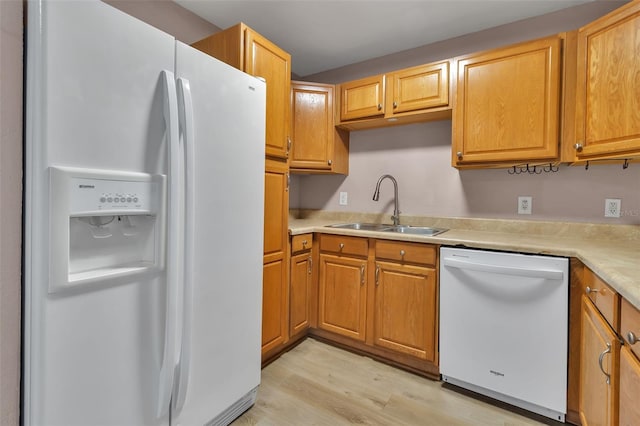 6439 Lafayette Rd, Bradenton, FL 34207 - kitchen with white appliances, light wood finished floors, and light countertops