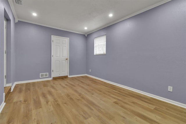 6439 Lafayette Rd, Bradenton, FL 34207 - spare room featuring ornamental molding, light wood-type flooring, and recessed lighting