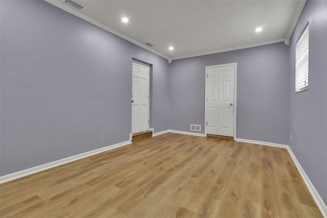 6439 Lafayette Rd, Bradenton, FL 34207 - empty room with ornamental molding, light wood-style floors, and recessed lighting
