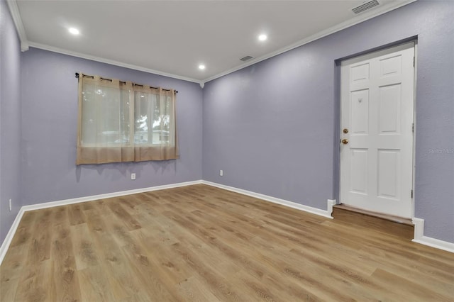 6439 Lafayette Rd, Bradenton, FL 34207 - empty room featuring ornamental molding, wood finished floors, and recessed lighting