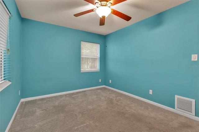 6439 Lafayette Rd, Bradenton, FL 34207 - carpeted spare room with baseboards and ceiling fan