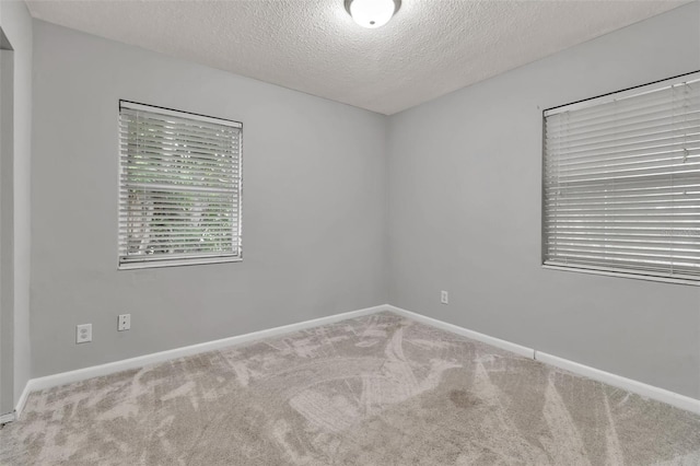 6439 Lafayette Rd, Bradenton, FL 34207 - empty room featuring carpet and a textured ceiling