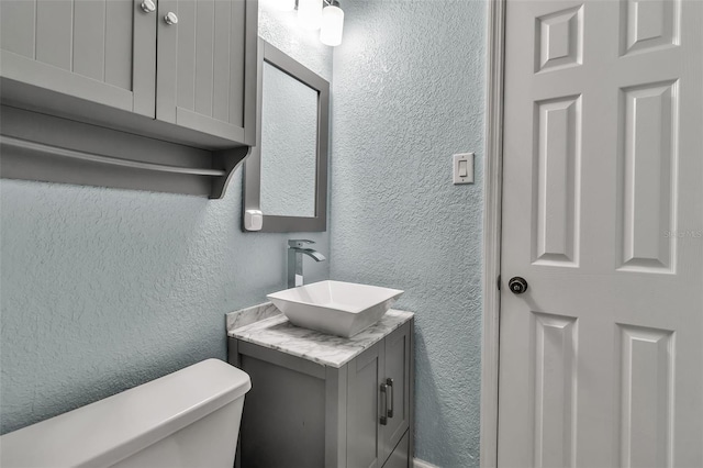 6439 Lafayette Rd, Bradenton, FL 34207 - bathroom featuring a textured wall and vanity