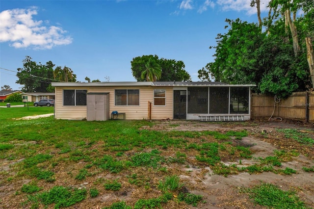 6439 Lafayette Rd, Bradenton, FL 34207 - rear view of property with a sunroom