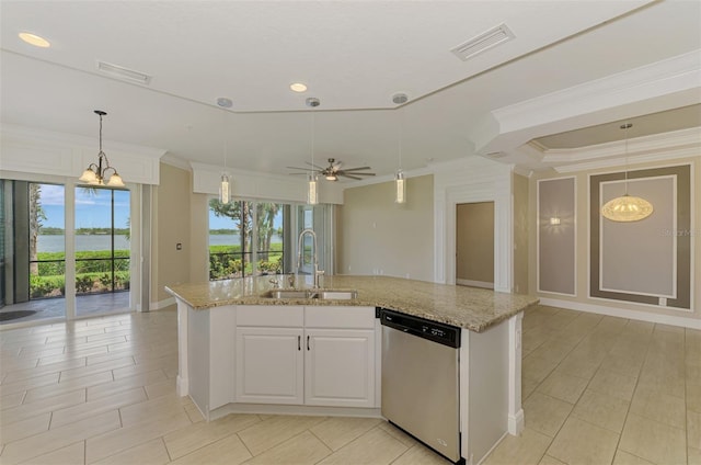 1226 Riverscape St, Bradenton, FL 34208 - kitchen with stainless steel dishwasher, ornamental molding, open floor plan, light stone countertops, and an island with sink
