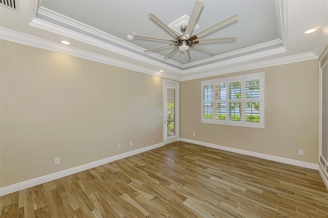 1226 Riverscape St, Bradenton, FL 34208 - empty room with a tray ceiling, crown molding, light wood-style flooring, ceiling fan, and recessed lighting