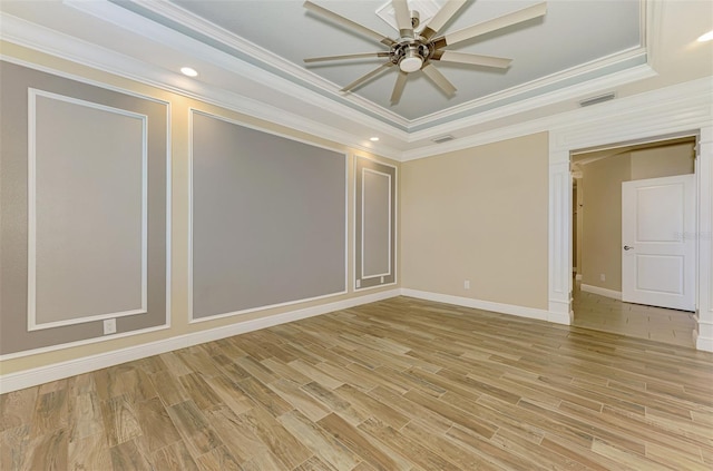 1226 Riverscape St, Bradenton, FL 34208 - empty room featuring a raised ceiling, ceiling fan, ornamental molding, light wood-style flooring, and recessed lighting