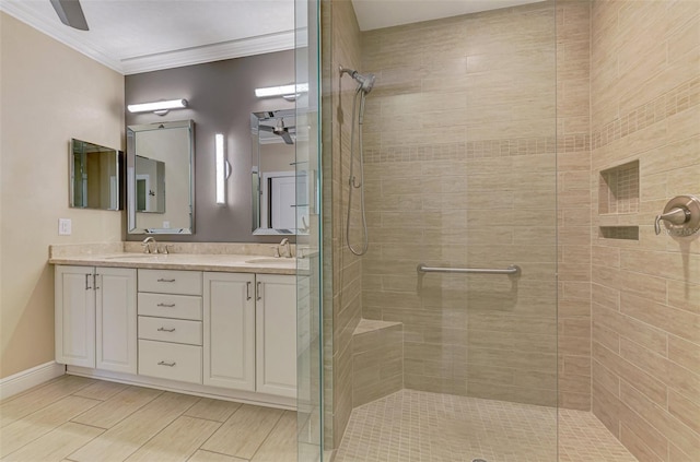 1226 Riverscape St, Bradenton, FL 34208 - bathroom featuring a ceiling fan, a shower stall, ornamental molding, and double vanity