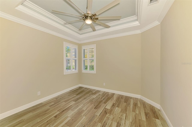 1226 Riverscape St, Bradenton, FL 34208 - spare room with a tray ceiling, light wood-style floors, crown molding, and a ceiling fan