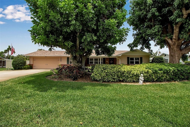 1907 76th St NW, Bradenton, FL 34209 - ranch-style house with driveway, an attached garage, and a front lawn