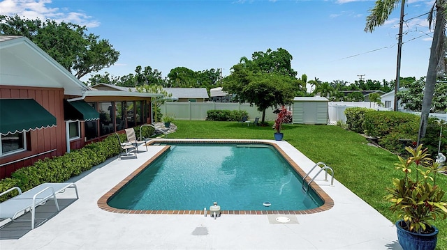 1907 76th St NW, Bradenton, FL 34209 - view of swimming pool with a fenced backyard, a patio, and a storage unit