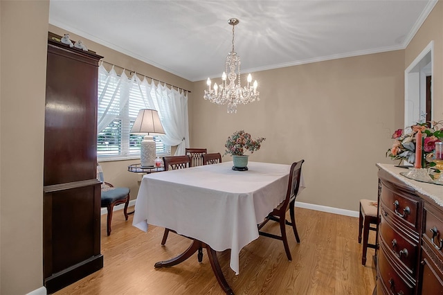 1907 76th St NW, Bradenton, FL 34209 - dining room with a chandelier, light wood finished floors, and crown molding
