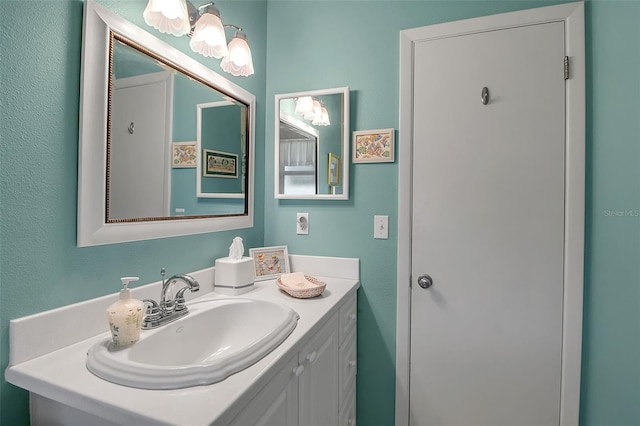 1907 76th St NW, Bradenton, FL 34209 - bathroom with vanity and a chandelier