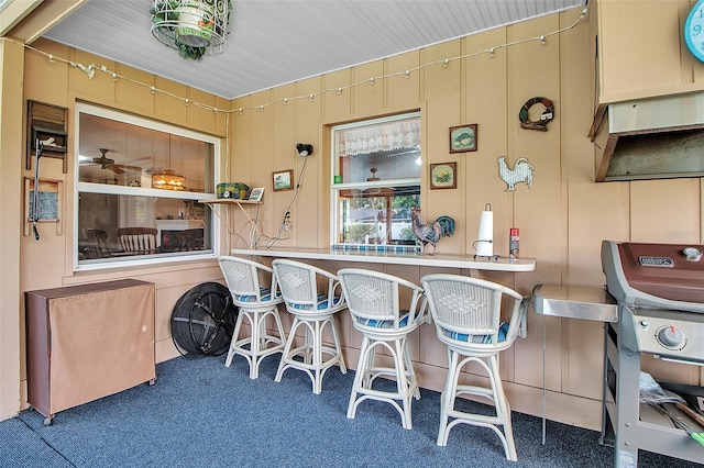 1907 76th St NW, Bradenton, FL 34209 - kitchen with carpet floors and a breakfast bar