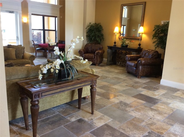 8397 38th Street Cir E Unit 305, Sarasota, FL 34243 - living area featuring stone tile floors and baseboards