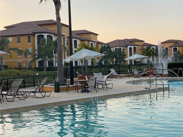 8397 38th Street Cir E Unit 305, Sarasota, FL 34243 - community pool with a patio area and a residential view