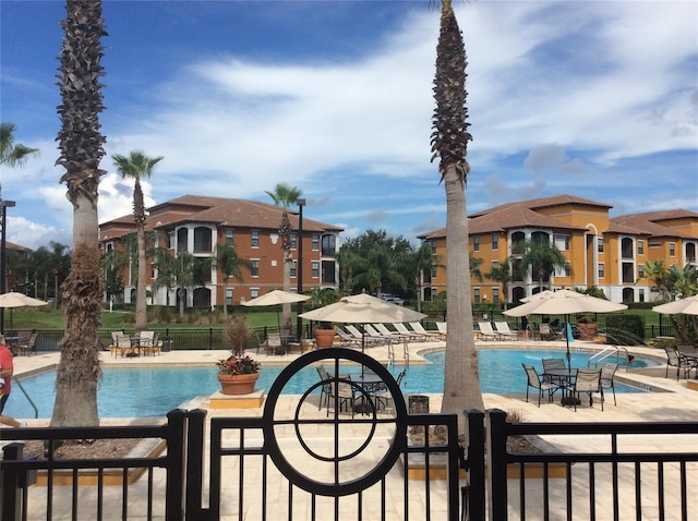8397 38th Street Cir E Unit 305, Sarasota, FL 34243 - community pool featuring a patio