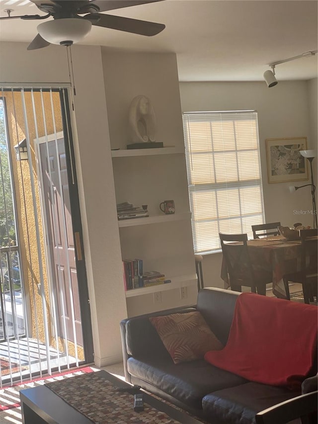 8397 38th Street Cir E Unit 305, Sarasota, FL 34243 - living room with a ceiling fan, healthy amount of natural light, and built in shelves