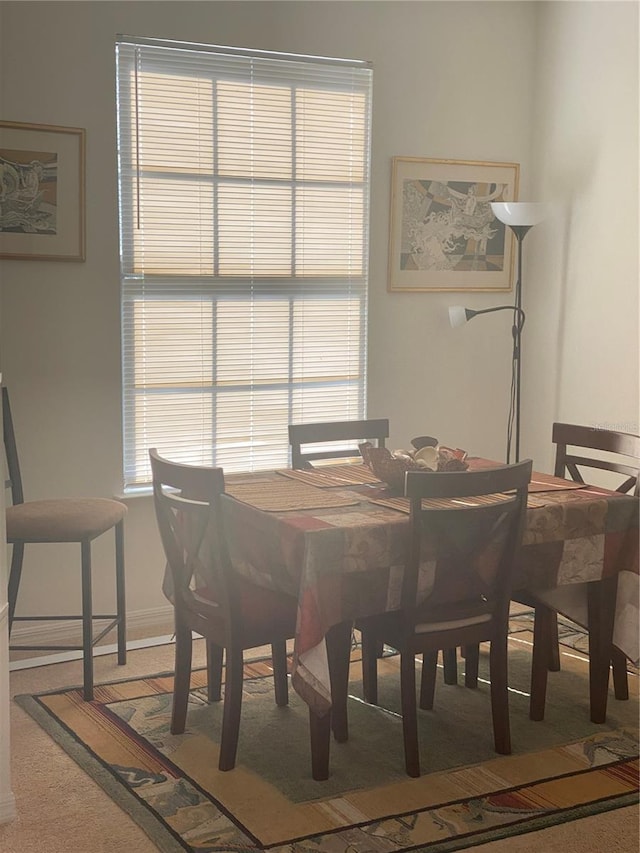 8397 38th Street Cir E Unit 305, Sarasota, FL 34243 - dining space featuring carpet flooring and baseboards