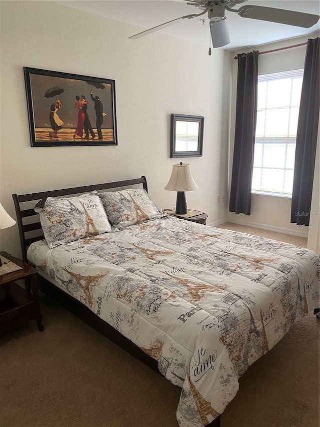 8397 38th Street Cir E Unit 305, Sarasota, FL 34243 - carpeted bedroom featuring a ceiling fan and baseboards