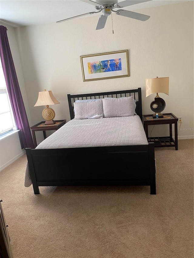 8397 38th Street Cir E Unit 305, Sarasota, FL 34243 - carpeted bedroom featuring baseboards and a ceiling fan