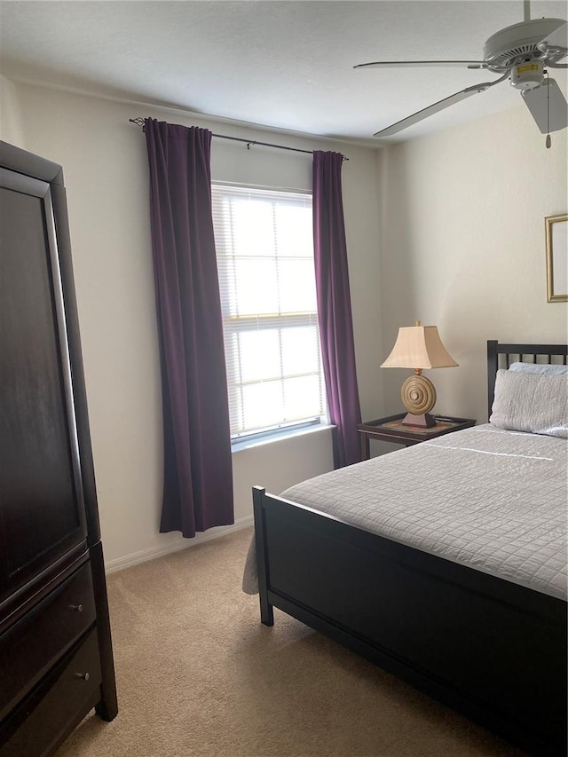 8397 38th Street Cir E Unit 305, Sarasota, FL 34243 - bedroom with light colored carpet and ceiling fan