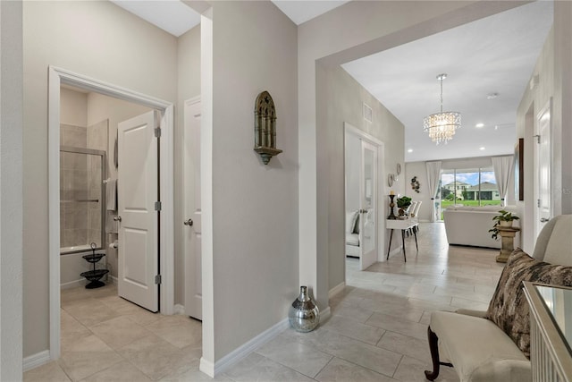 5313 Halewood Ct, Lakewood Ranch, FL 34211 - entrance foyer with a chandelier, light tile patterned floors, and recessed lighting