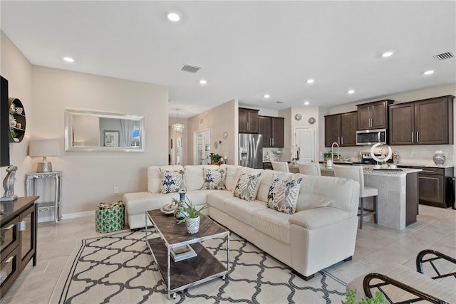 5313 Halewood Ct, Lakewood Ranch, FL 34211 - living area with recessed lighting and light tile patterned floors