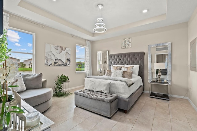 5313 Halewood Ct, Lakewood Ranch, FL 34211 - bedroom featuring a tray ceiling and light tile patterned flooring
