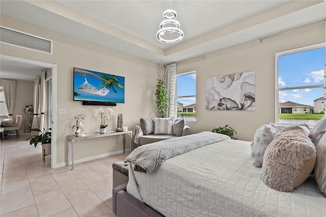5313 Halewood Ct, Lakewood Ranch, FL 34211 - bedroom with light tile patterned floors and a tray ceiling