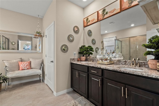 5313 Halewood Ct, Lakewood Ranch, FL 34211 - bathroom featuring double vanity, a stall shower, and tile patterned floors