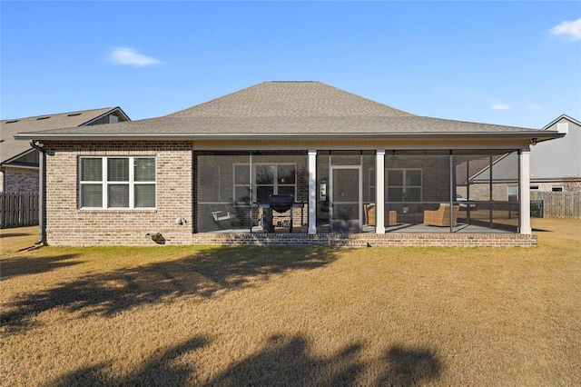 636 Meadow Lake Dr, Freeport, FL 32439 - back of property with brick siding, a sunroom, and a patio area