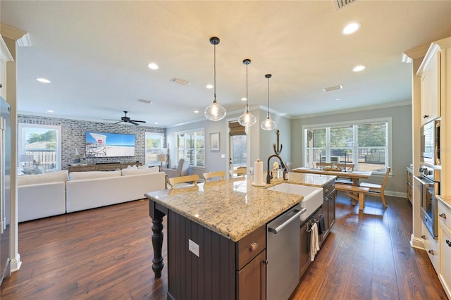 636 Meadow Lake Dr, Freeport, FL 32439 - kitchen featuring stainless steel appliances, a breakfast bar, crown molding, dark wood-style flooring, and a ceiling fan