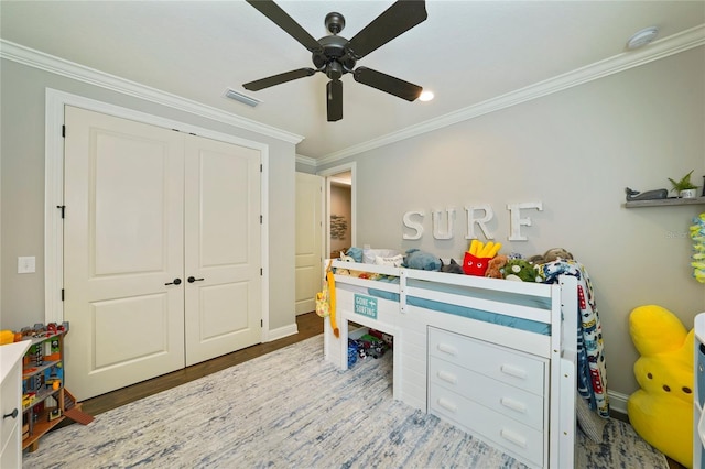 636 Meadow Lake Dr, Freeport, FL 32439 - bedroom featuring ornamental molding, wood finished floors, a closet, and a ceiling fan