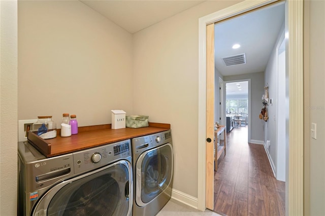 636 Meadow Lake Dr, Freeport, FL 32439 - laundry room featuring independent washer and dryer and wood finished floors