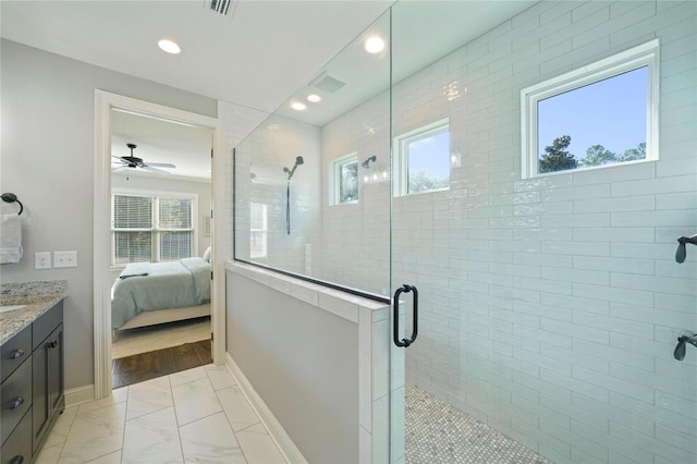 636 Meadow Lake Dr, Freeport, FL 32439 - ensuite bathroom featuring vanity, a stall shower, healthy amount of natural light, recessed lighting, and marble look tile flooring