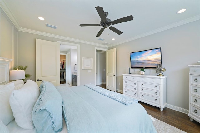 636 Meadow Lake Dr, Freeport, FL 32439 - bedroom with dark wood-style floors, crown molding, a spacious closet, a ceiling fan, and recessed lighting