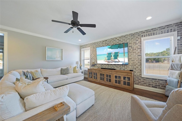 636 Meadow Lake Dr, Freeport, FL 32439 - living room featuring crown molding, wood finished floors, a ceiling fan, recessed lighting, and brick wall