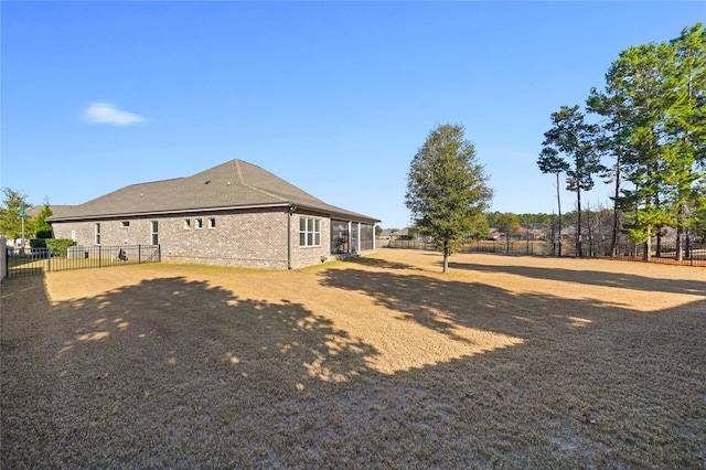636 Meadow Lake Dr, Freeport, FL 32439 - view of side of property with a fenced backyard and brick siding