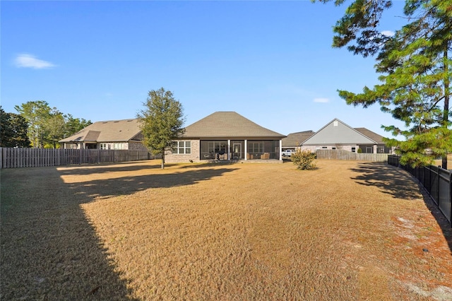 636 Meadow Lake Dr, Freeport, FL 32439 - fenced backyard with a sunroom