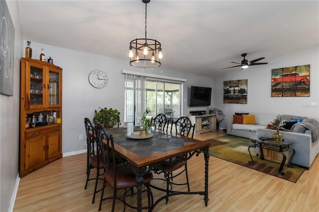 616 Bryan Terrace Dr, Brandon, FL 33511 - dining space with light wood-style flooring, a ceiling fan, and a chandelier