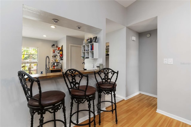 616 Bryan Terrace Dr, Brandon, FL 33511 - kitchen featuring wood finished floors and a kitchen bar