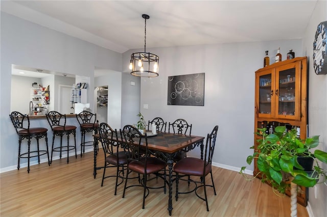 616 Bryan Terrace Dr, Brandon, FL 33511 - dining area with light wood-type flooring and a chandelier