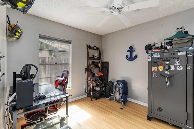 616 Bryan Terrace Dr, Brandon, FL 33511 - home office featuring light wood-style flooring, a ceiling fan, and a textured ceiling