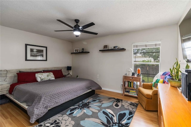 616 Bryan Terrace Dr, Brandon, FL 33511 - bedroom featuring light wood-type flooring, a textured ceiling, and a ceiling fan