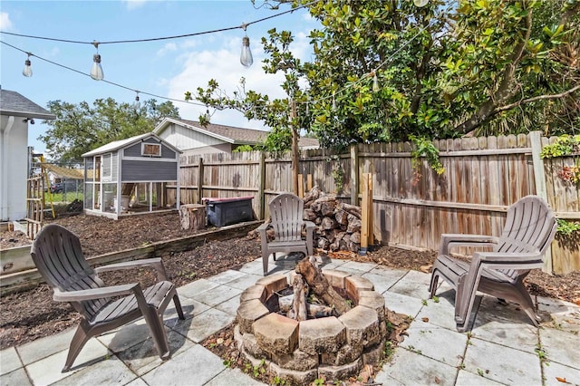 616 Bryan Terrace Dr, Brandon, FL 33511 - view of patio / terrace with exterior structure, an outdoor fire pit, and an outdoor structure