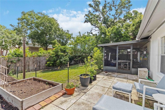 616 Bryan Terrace Dr, Brandon, FL 33511 - view of patio featuring a vegetable garden and a sunroom