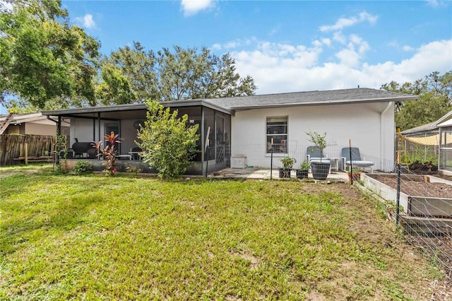 616 Bryan Terrace Dr, Brandon, FL 33511 - rear view of house featuring a vegetable garden and a sunroom