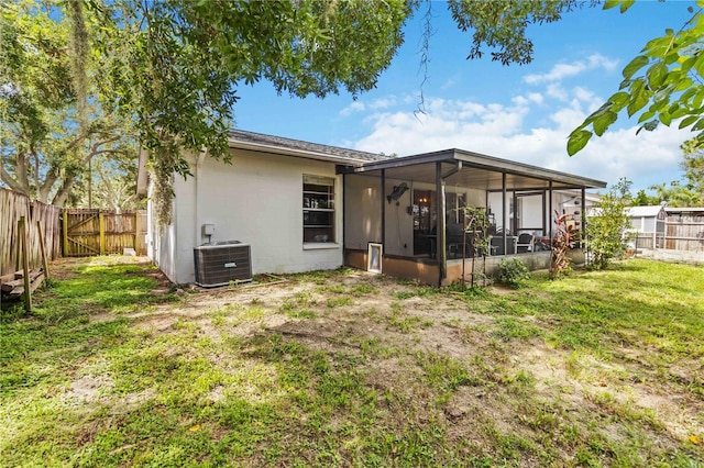 616 Bryan Terrace Dr, Brandon, FL 33511 - back of house with a sunroom, a fenced backyard, and concrete block siding