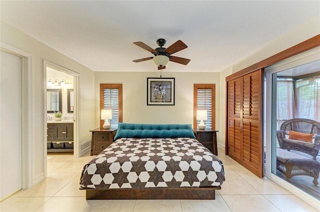 133 Tucker Ave, Sarasota, FL 34232 - bedroom with multiple windows, light tile patterned flooring, and a closet